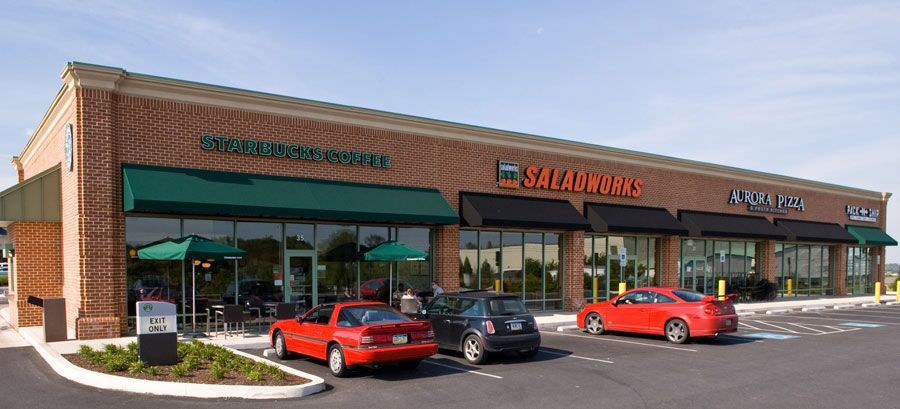 Commercial awnings over multiple businesses in Wilmington, DE plaza