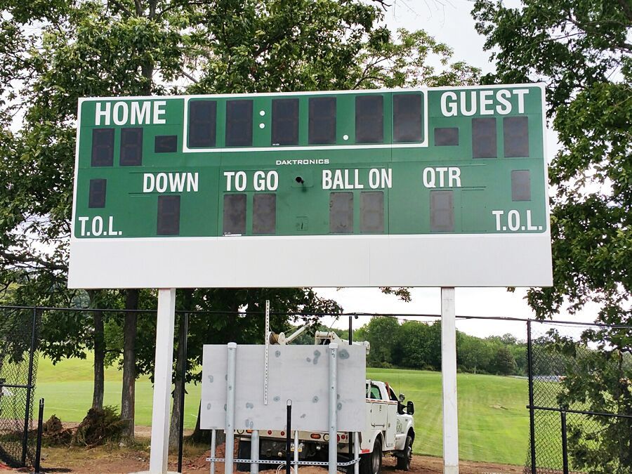 Custom scoreboard and business sign combination