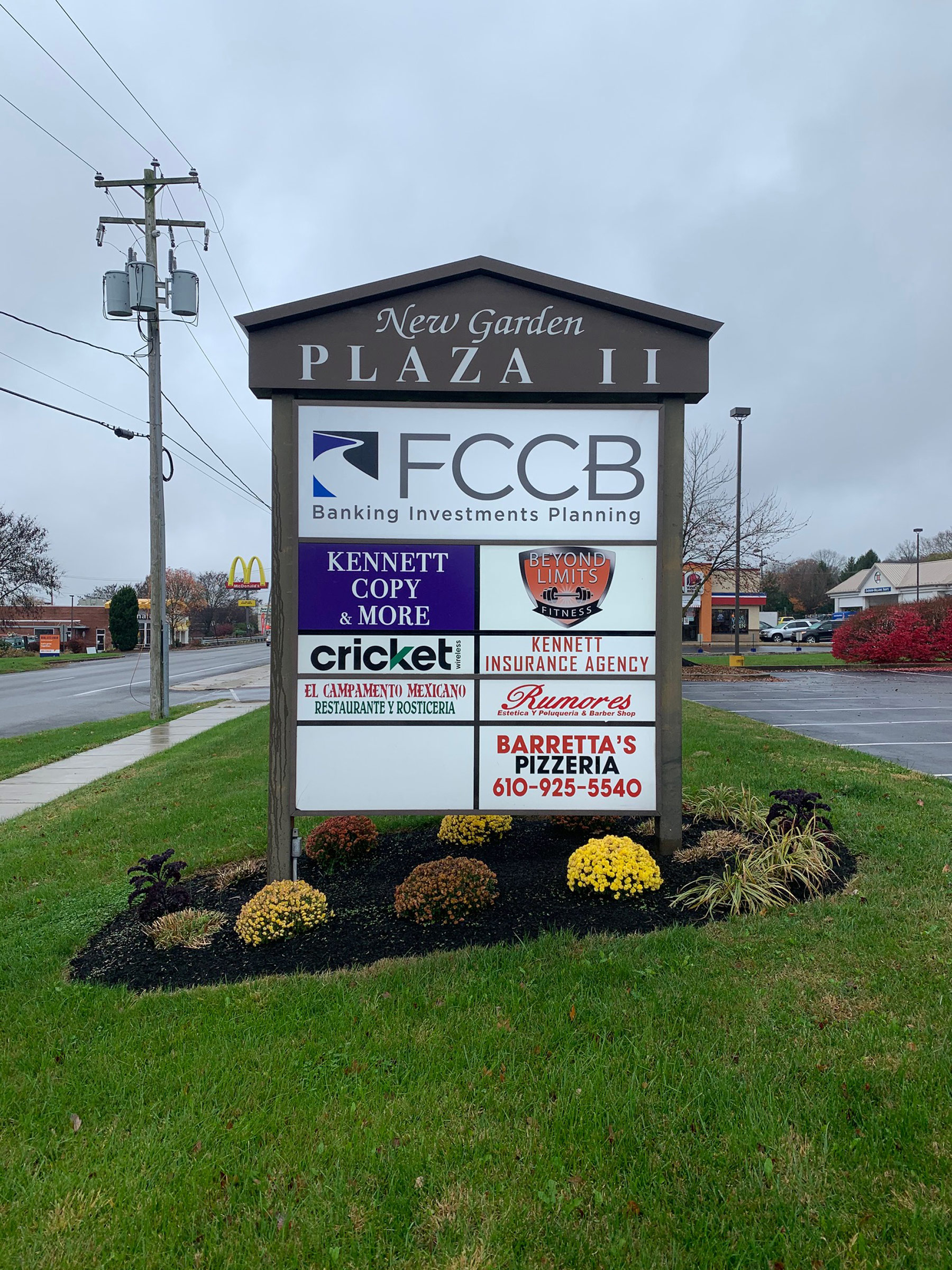 a monument sign with business logos in Newark