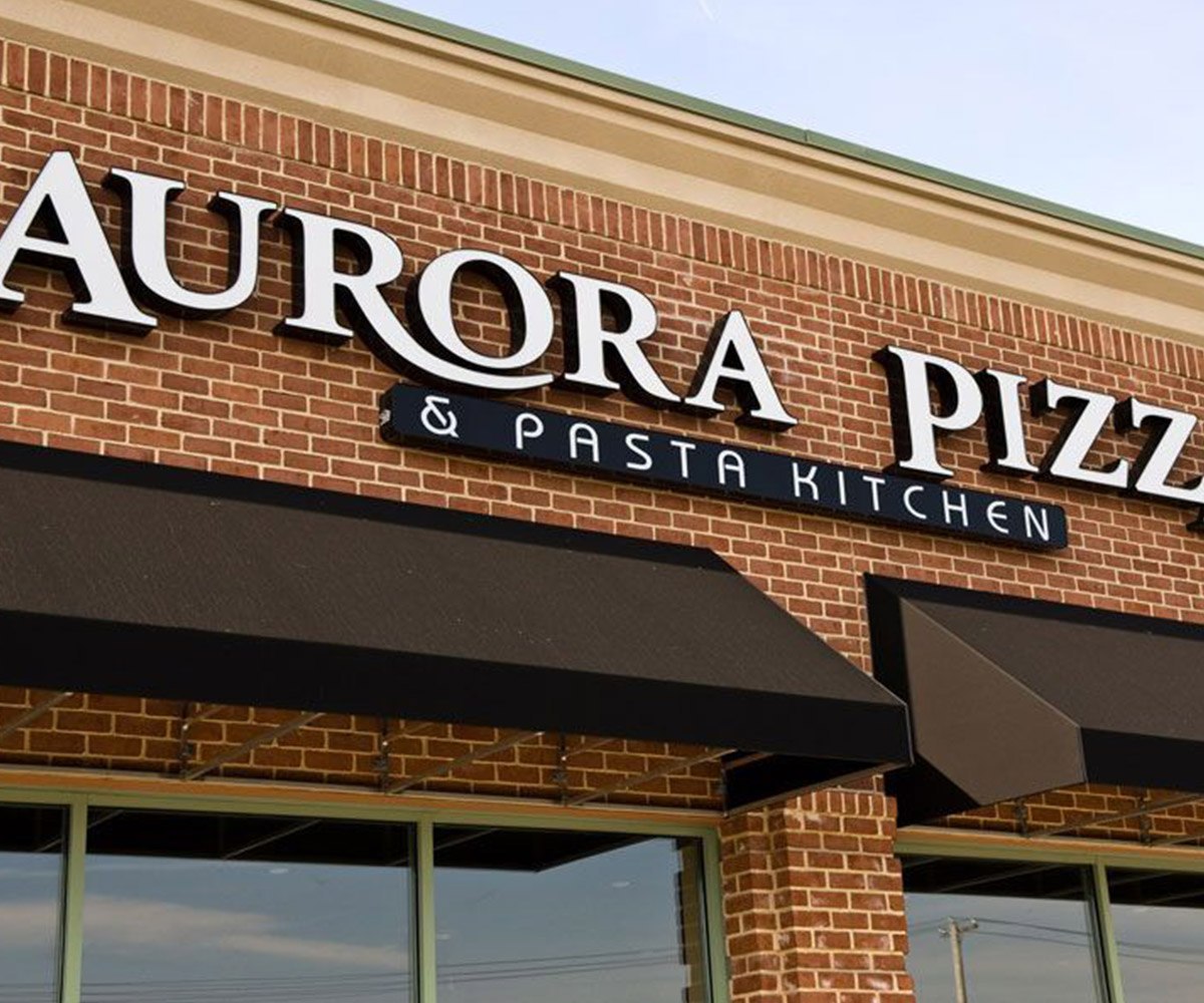 Black Commercial Awning on Aurora Pizza & Pasta Kitchen's Brick Building in New Castle, DE