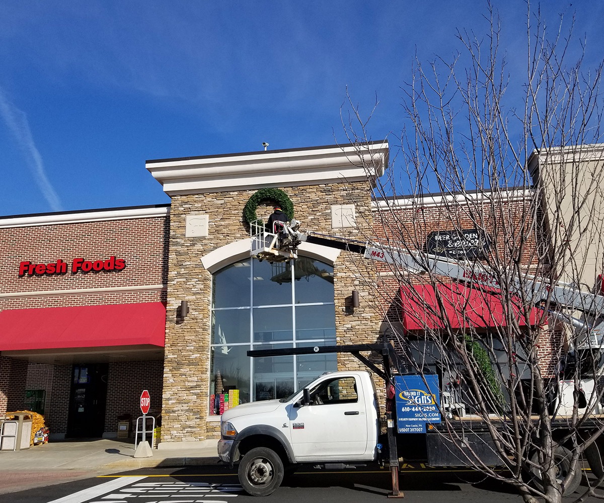 Red Commercial Awnings Being Installed in Shopping Center in Warren, OH