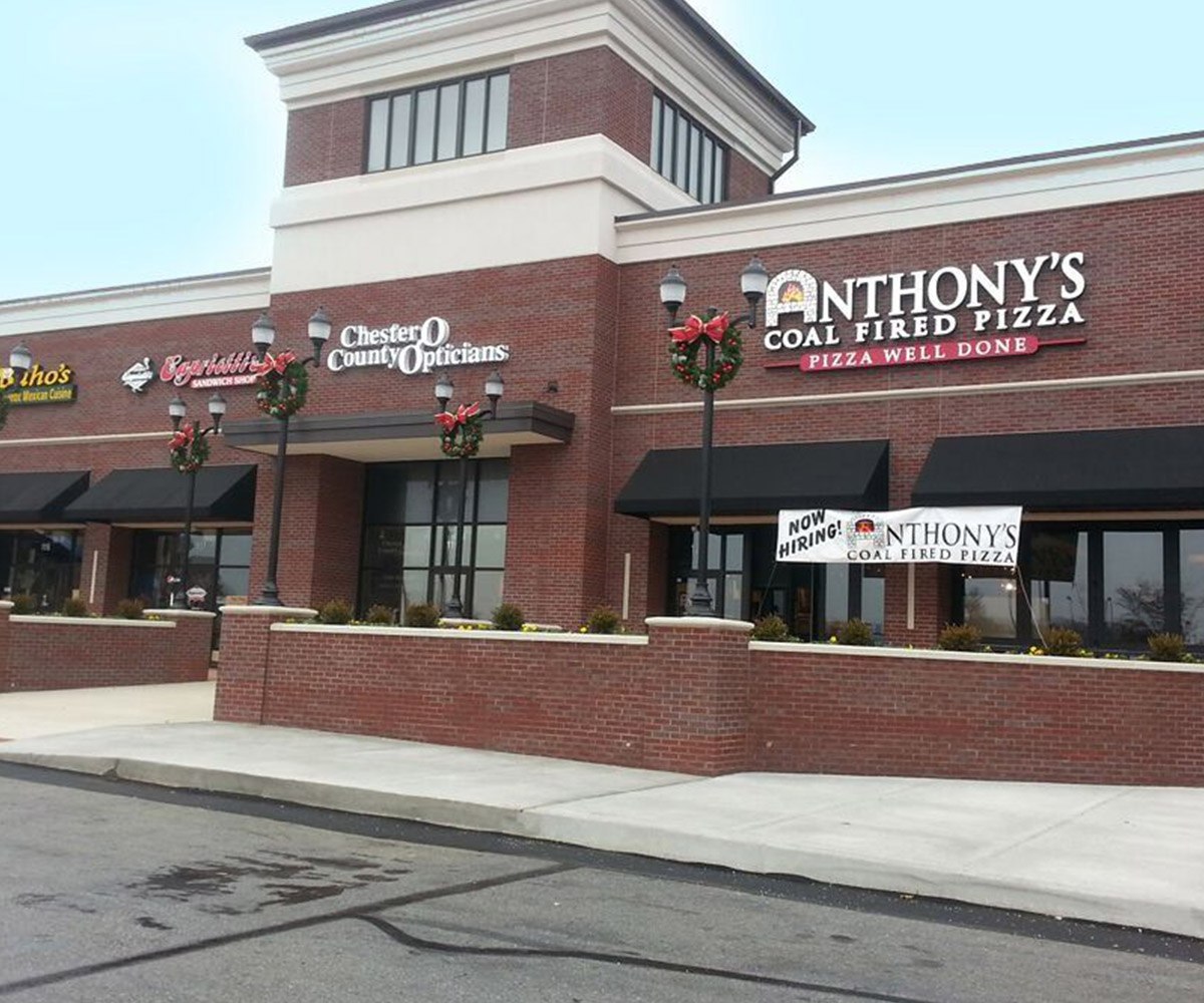 Brick Shopping Center with Black Commercial Awnings in Hermitage, PA